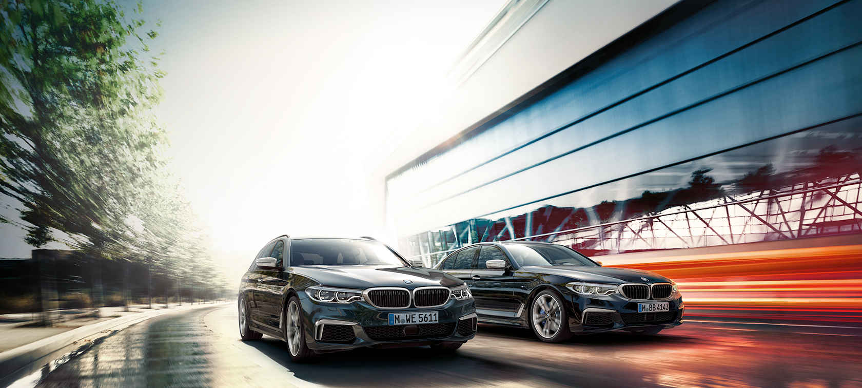 BMW M550d xDrive Touring G31 toonis Azurite Black metallik, 3/4 külgvaade